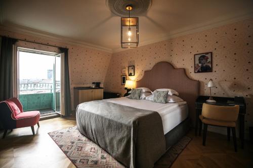 Postel nebo postele na pokoji v ubytování Hotel Capital