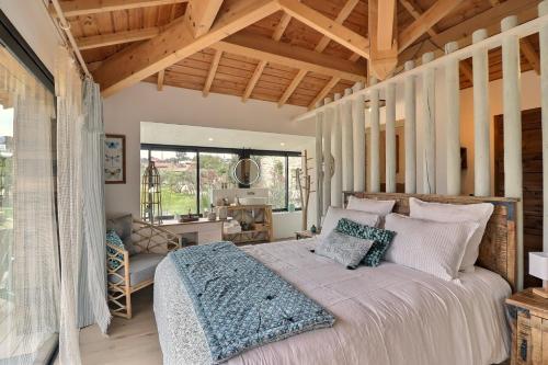 a bedroom with a large bed in a room at LA BASTIDE DES CULS-ROUSSET in Marseille