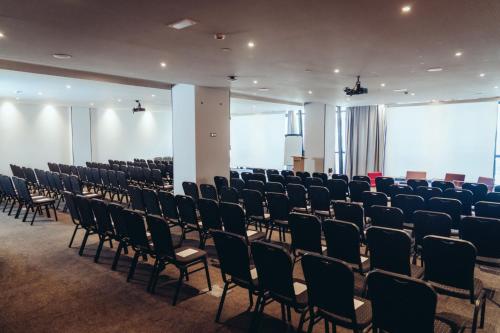 a room with rows of chairs in a building at ONOMO Hotel Casablanca City Center in Casablanca