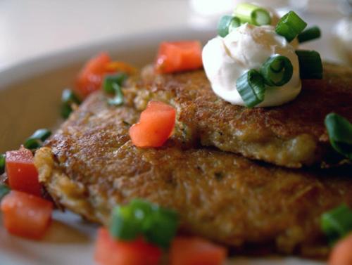 a close up of a plate of food with sour cream and vegetables at The Portlander Inn and Marketplace in Portland
