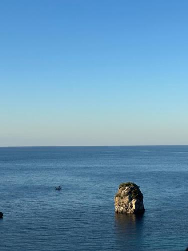 a small island in the middle of the ocean at Sea Bliss Adults Only in Parga