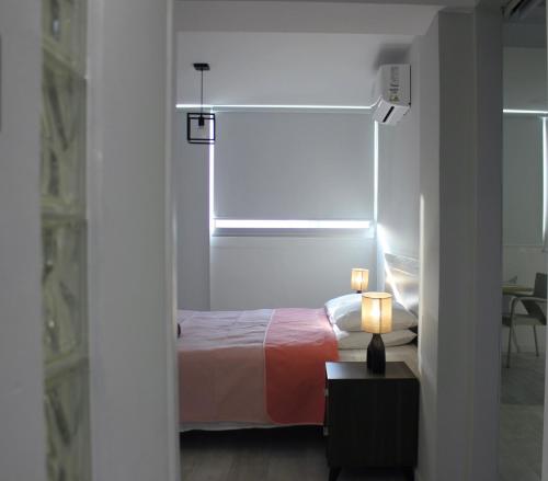 Ένα ή περισσότερα κρεβάτια σε δωμάτιο στο Nicosia Central Suites