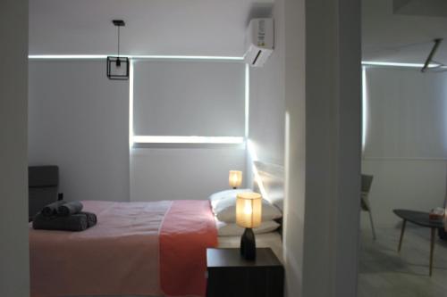 Ένα ή περισσότερα κρεβάτια σε δωμάτιο στο Nicosia Central Suites
