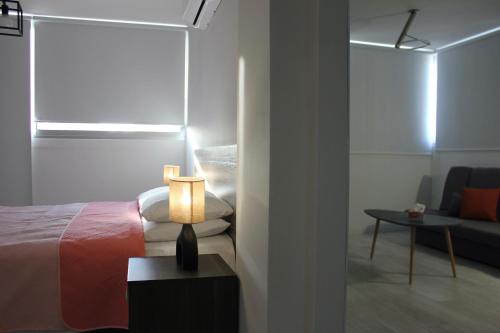 Ένα ή περισσότερα κρεβάτια σε δωμάτιο στο Nicosia Central Suites