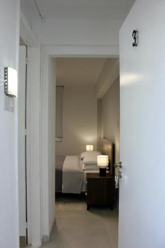 Ένα ή περισσότερα κρεβάτια σε δωμάτιο στο Nicosia Central Suites