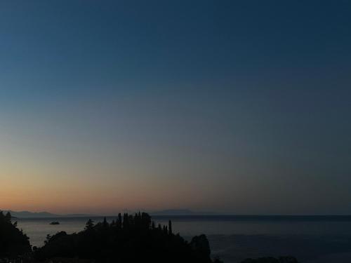 a view of the ocean at sunset at Sea Bliss Adults Only in Parga
