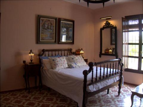 Postel nebo postele na pokoji v ubytování Cortijo de Mariangela tres