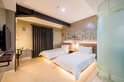 Un ou plusieurs lits dans un hébergement de l'établissement Stark Boutique Hotel and Spa