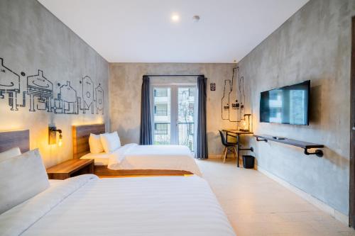 Un ou plusieurs lits dans un hébergement de l'établissement Stark Boutique Hotel and Spa