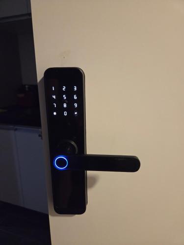 a black remote control with a blue light on it at LOFT512 Maxplaza Canoas in Canoas