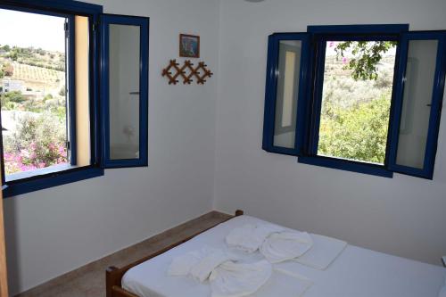 Ένα ή περισσότερα κρεβάτια σε δωμάτιο στο ANEVOLEMA