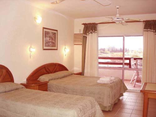 Ένα ή περισσότερα κρεβάτια σε δωμάτιο στο Terrazas de La Costa