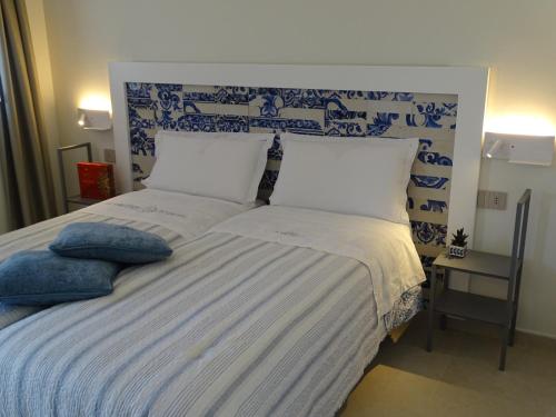 Ένα ή περισσότερα κρεβάτια σε δωμάτιο στο Relais Palmento 1866 Torre Favara