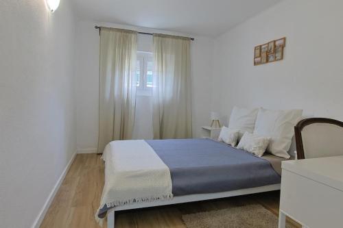 Ένα ή περισσότερα κρεβάτια σε δωμάτιο στο Maria's House