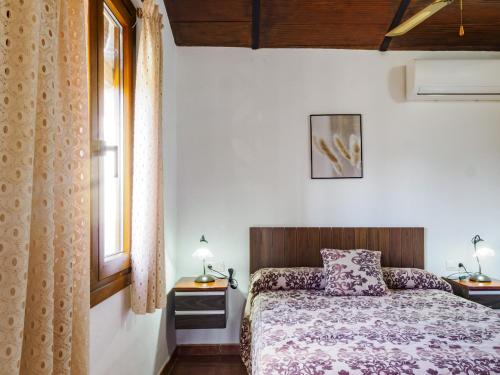 Ένα ή περισσότερα κρεβάτια σε δωμάτιο στο Cubo's Casa Rural Jose & Caminito del Rey