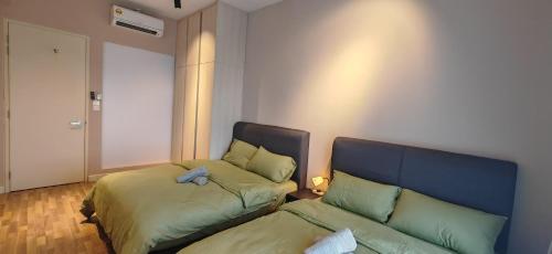 a living room with two beds and a couch at Sunway Geo Suites at Bandar Sunway by Ezprop-CA0F in Subang Jaya