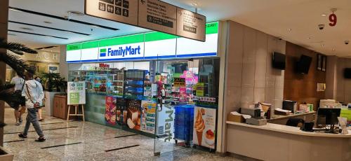 a store in a shopping mall with a man walking past it at Sunway Geo Suites at Bandar Sunway by Ezprop-CA0F in Subang Jaya