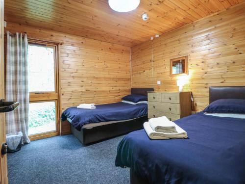 Katil atau katil-katil dalam bilik di Chestnut Lodge