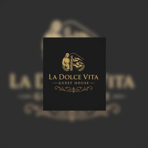 a sign for la dolce vita guest house at La Dolce Vita in Cascia