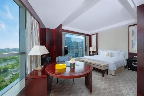 Ένα ή περισσότερα κρεβάτια σε δωμάτιο στο Pan Pacific Ningbo