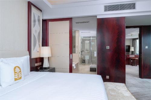 Ένα ή περισσότερα κρεβάτια σε δωμάτιο στο Pan Pacific Ningbo