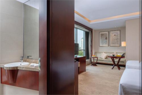 Ένα ή περισσότερα κρεβάτια σε δωμάτιο στο Pan Pacific Ningbo