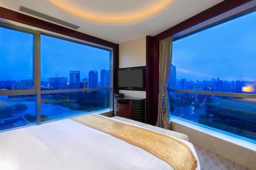 Ένα ή περισσότερα κρεβάτια σε δωμάτιο στο Pan Pacific Ningbo