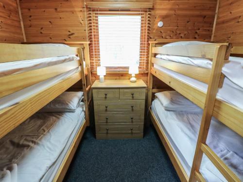 Postel nebo postele na pokoji v ubytování Sycamore Lodge