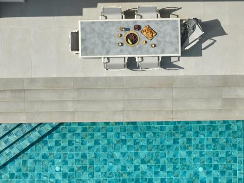 an overhead view of a swimming pool at Kyamon Luxury Villa - Peaceful Escape with Heated Pool near Chania! in Chania Town