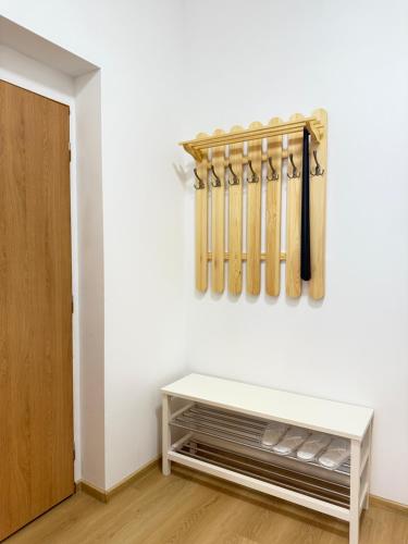 a room with baseball bats hanging on a wall at Riverside Apartment Praha in Prague