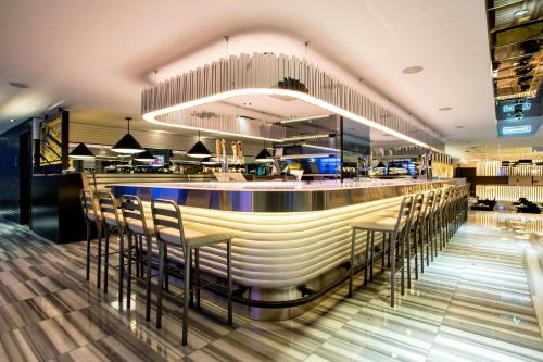 a bar in a restaurant with stools at The Wade in Chicago