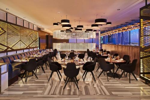 a restaurant with tables and chairs and a bar at The Wade in Chicago