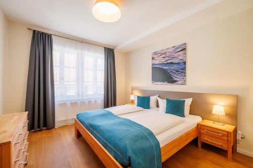 a bedroom with a large bed and a window at Gasthaus Adler Konstanz in Konstanz