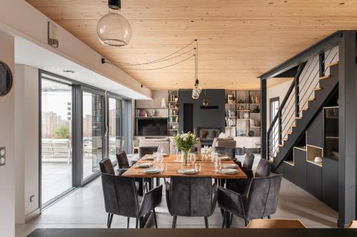 a dining room with a table and chairs at Villa Ker Jade - vue sur la mer in Lancieux