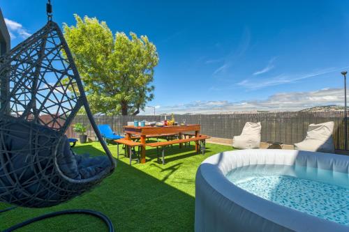 a backyard with a hammock and a picnic table at Vita Portucale ! Santa Clara Terrace & Jacuzzi in Lisbon