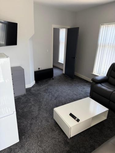 a living room with a couch and a coffee table at Royal Apartments SouthBank 1 in South Bank