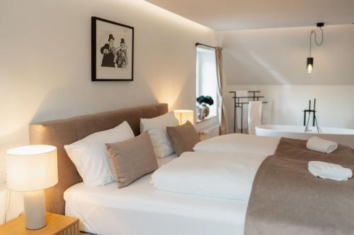 Ένα ή περισσότερα κρεβάτια σε δωμάτιο στο Ferienhaus Kapellenhof mit Infrarotsauna