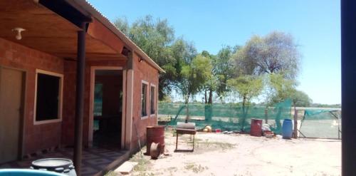 a house being remodeled with a table and chairs at Hospedaje El Quebracho in Caña de Castilla