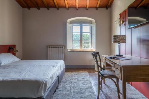 Postel nebo postele na pokoji v ubytování Relais Badia a Passignano