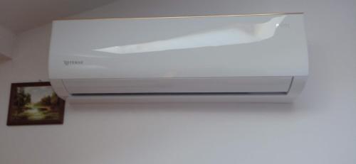 a white ventilator hanging from a ceiling at Pod Orzechem in Sanok