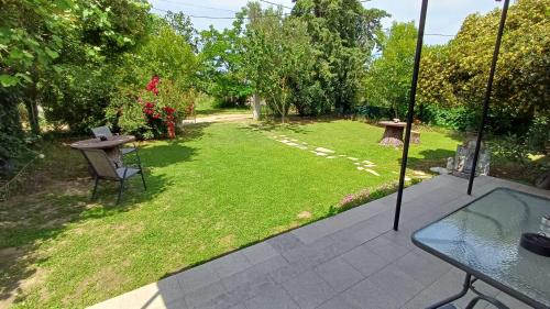 an aerial view of a garden with a table and a lawn at christos cottage! comfortable and quiet! in Keramotí