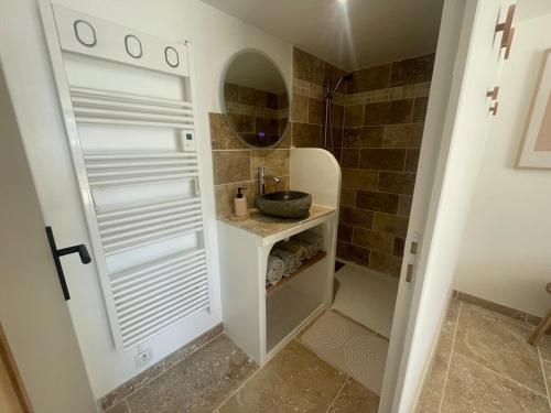 a small bathroom with a sink and a shower at Carpe Diem in Toulon