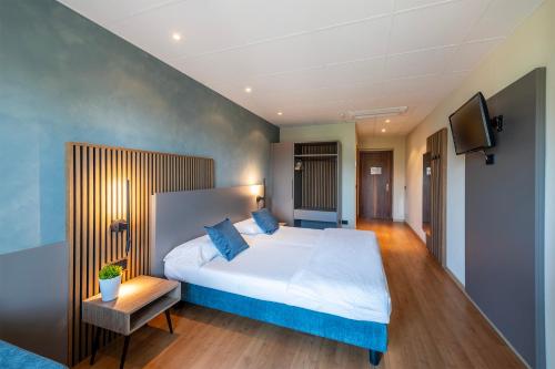 Katil atau katil-katil dalam bilik di Hotel Pineta Campi