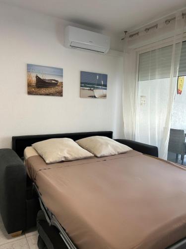 Postel nebo postele na pokoji v ubytování SOLEA Frontignan Plage