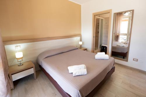 Postel nebo postele na pokoji v ubytování Villa Santangelo