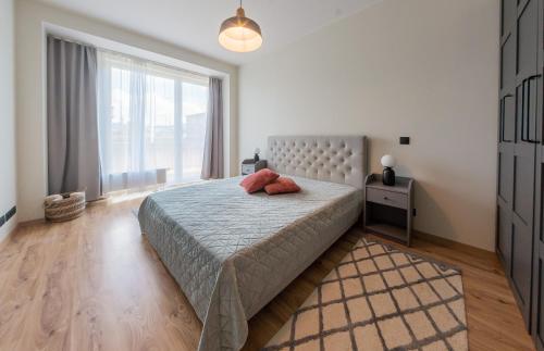 Postel nebo postele na pokoji v ubytování Stylish seaside apartment