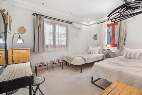 Ένα ή περισσότερα κρεβάτια σε δωμάτιο στο Cozy 2-bdrm-house With Garden