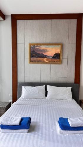Ένα ή περισσότερα κρεβάτια σε δωμάτιο στο Q Kata Residence
