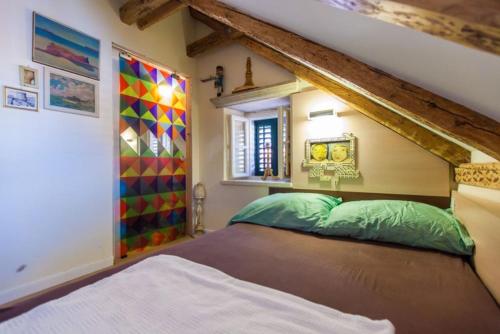 a bedroom with a bed in a room at Apartman Dominus in Dubrovnik