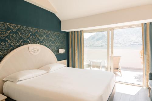 Postel nebo postele na pokoji v ubytování Hotel Ghiffa